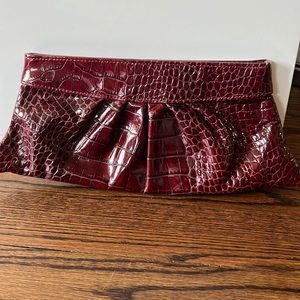 Lauren Merkin wine colored clutch